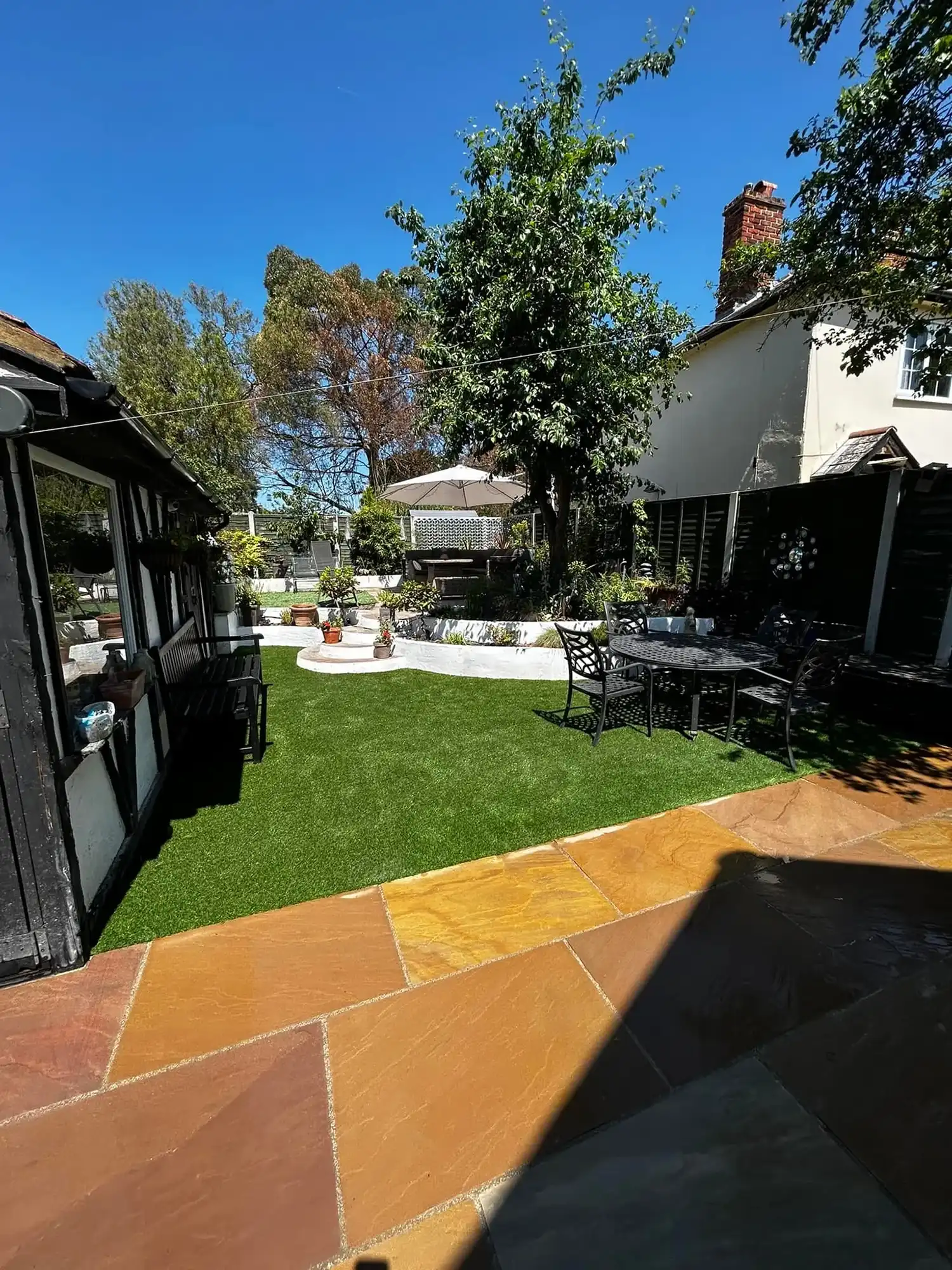 Brown patio with grass