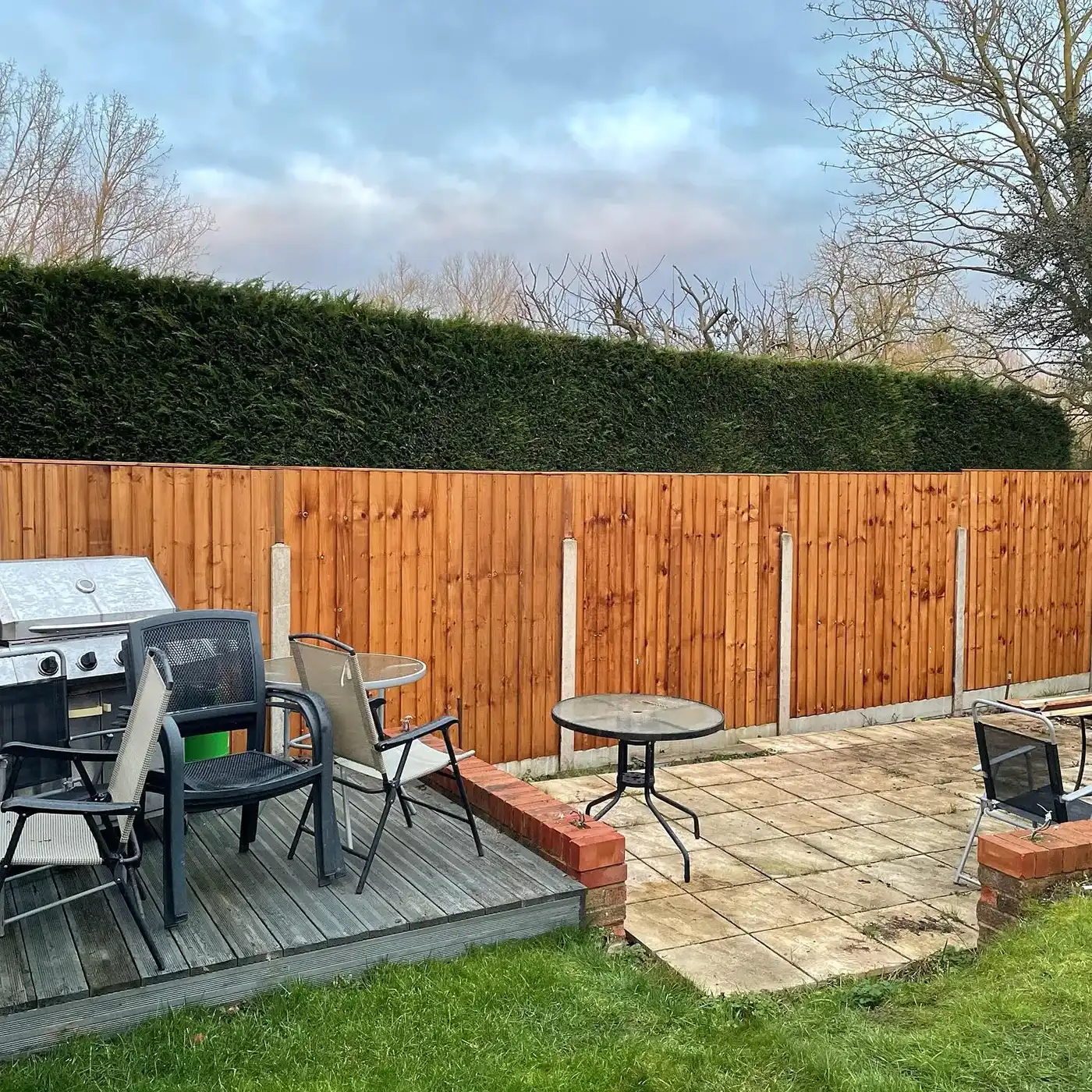Light brown fence with patio