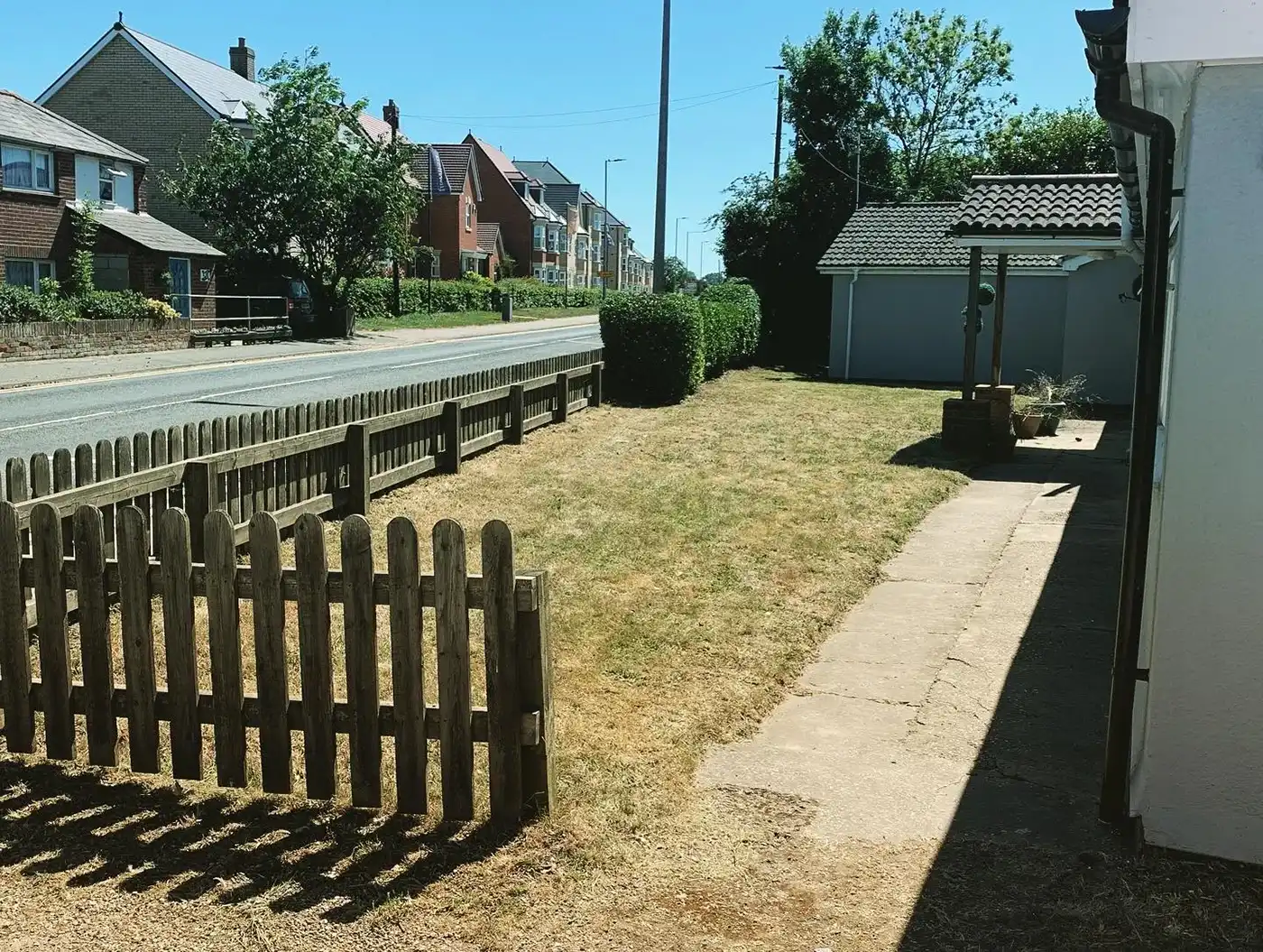Wooden fence next to grass