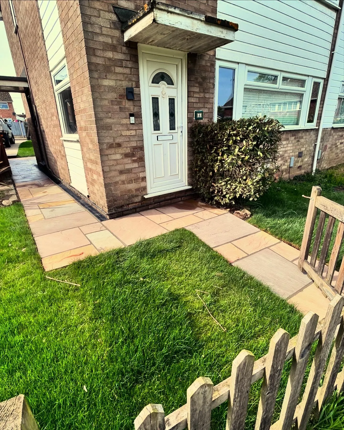 Fencing and bright green grass